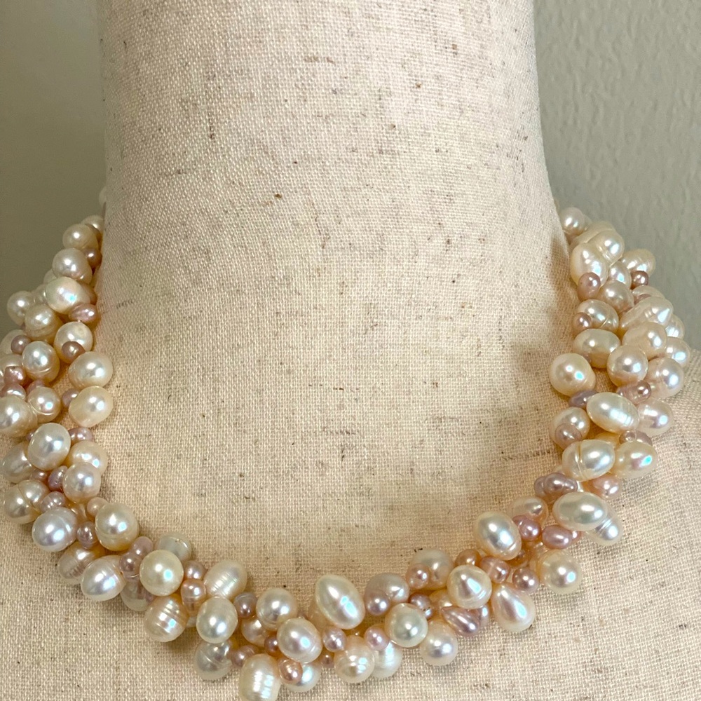 Fresh water pearls triple strand twisted necklace.